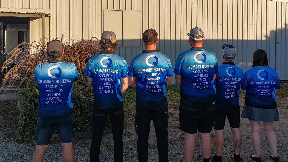 The CQ Smart Screens crew outside their Yeppoon shopfront in branded shirts